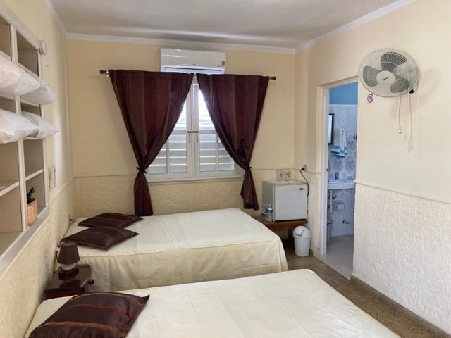 Cosy room with two double beds and inverter air conditioner