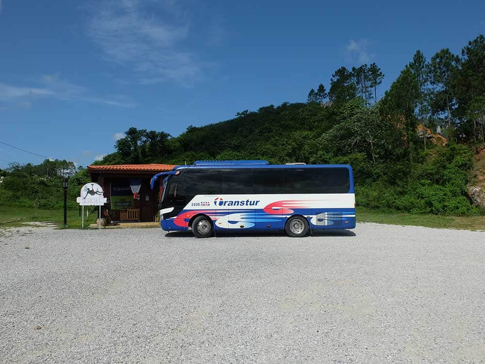Bus parked in front of the canopy tour office in Viñales, Cuba