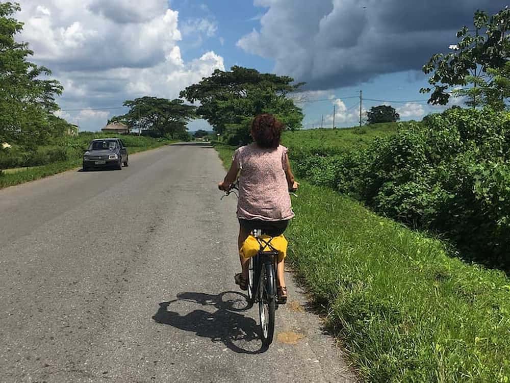 Cyclist on a road in Viñales National Park